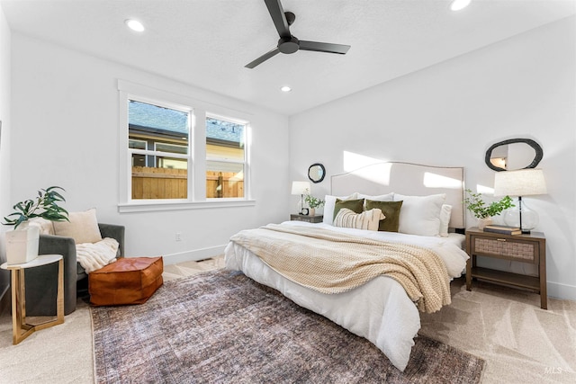 carpeted bedroom featuring ceiling fan