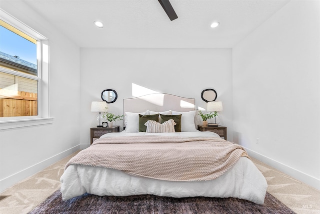 carpeted bedroom with ceiling fan