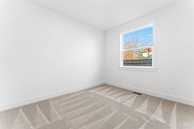 empty room featuring carpet flooring