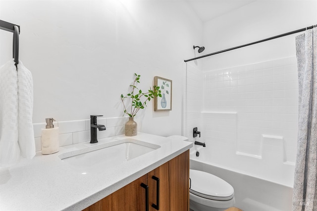 full bathroom featuring vanity, toilet, and shower / tub combo