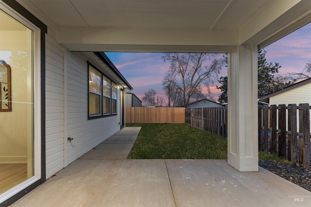 yard at dusk with a patio