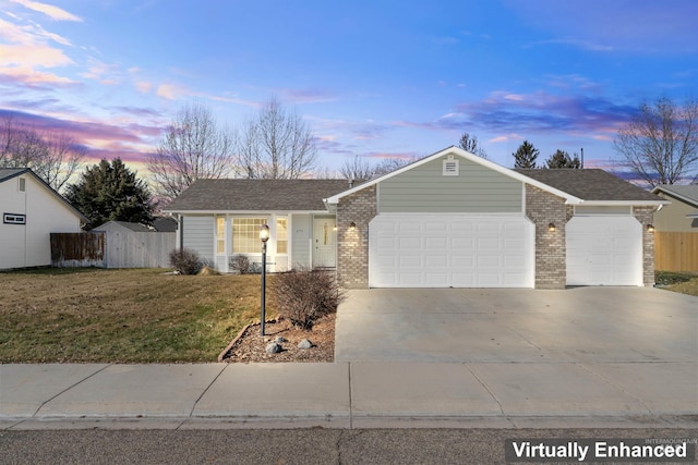 ranch-style home featuring an attached garage, fence, concrete driveway, and brick siding