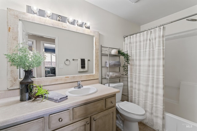 full bathroom with toilet, shower / tub combo with curtain, and vanity