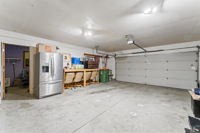 garage featuring stainless steel fridge