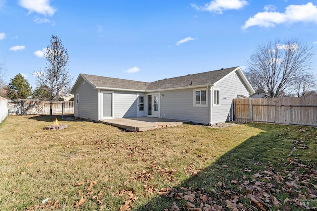 back of house with a patio area, a fenced backyard, and a lawn