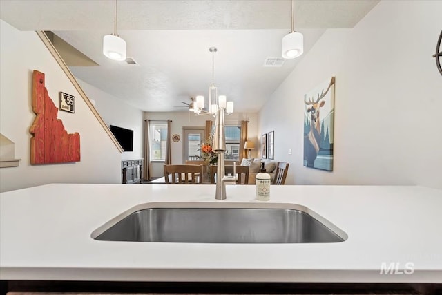 302 Broken Crk, Mccall, ID 83638 - kitchen featuring light countertops, decorative light fixtures, open floor plan, and a chandelier