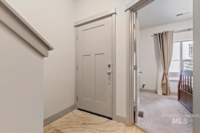 302 Broken Crk, Mccall, ID 83638 - foyer featuring baseboards and light carpet