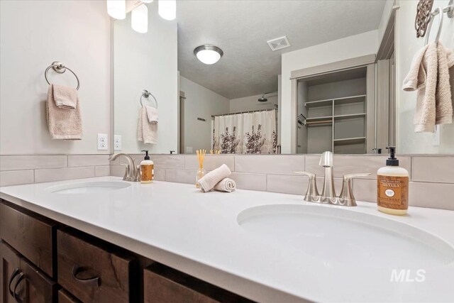 302 Broken Crk, Mccall, ID 83638 - bathroom featuring curtained shower and double vanity