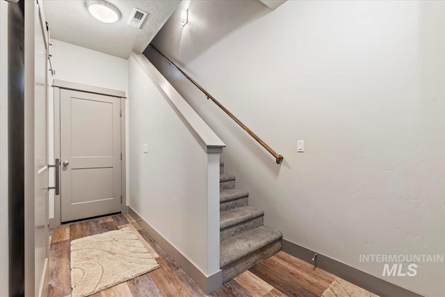 302 Broken Crk, Mccall, ID 83638 - staircase with wood finished floors and baseboards