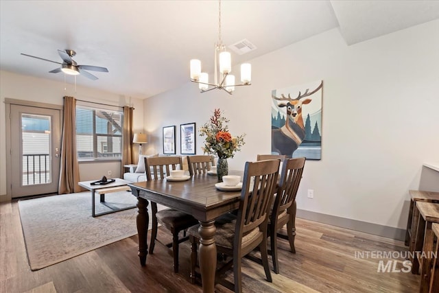 302 Broken Crk, Mccall, ID 83638 - dining space with wood finished floors, baseboards, ceiling fan, and a chandelier