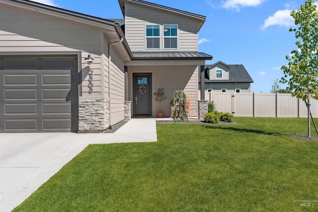 9868 Sunset Valley St, Star, ID 83669 - view of front facade with stone siding, an attached garage, a standing seam roof, and driveway