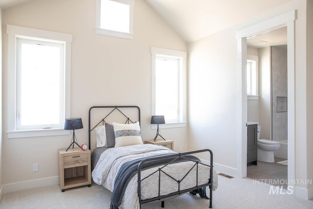 carpeted bedroom with baseboards, visible vents, multiple windows, and vaulted ceiling