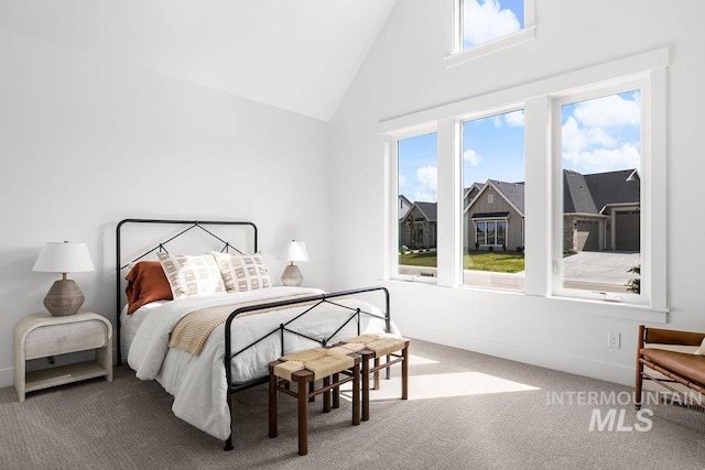 11179 N Elk Ridge Way, Boise, ID 83714 - carpeted bedroom featuring multiple windows, high vaulted ceiling, and baseboards