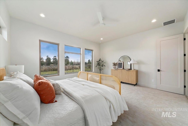 carpeted bedroom with ceiling fan