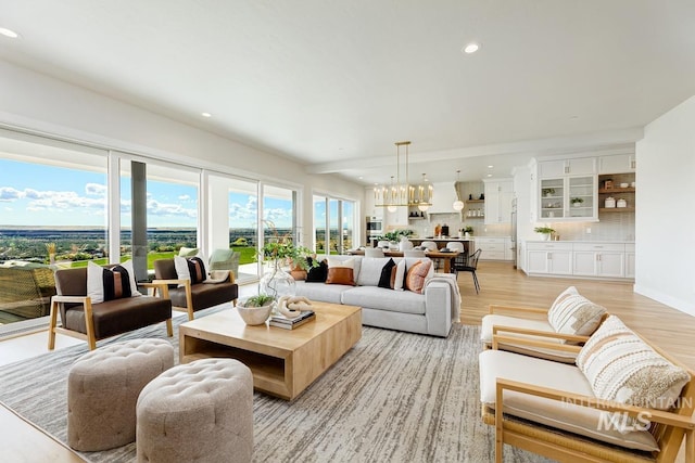 5935 E Marmount Ct, Boise, ID 83716 - living area featuring recessed lighting, light wood-style flooring, and a chandelier