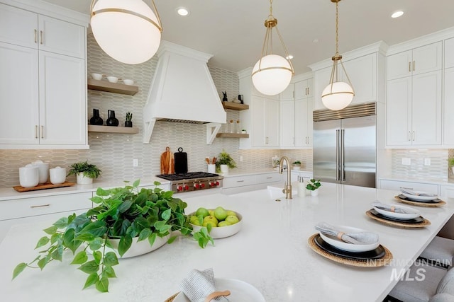 5935 E Marmount Ct, Boise, ID 83716 - kitchen featuring open shelves, appliances with stainless steel finishes, premium range hood, light countertops, and recessed lighting