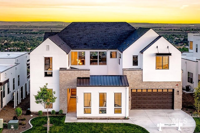 5935 E Marmount Ct, Boise, ID 83716 - view of front of home featuring brick siding, driveway, and stucco siding