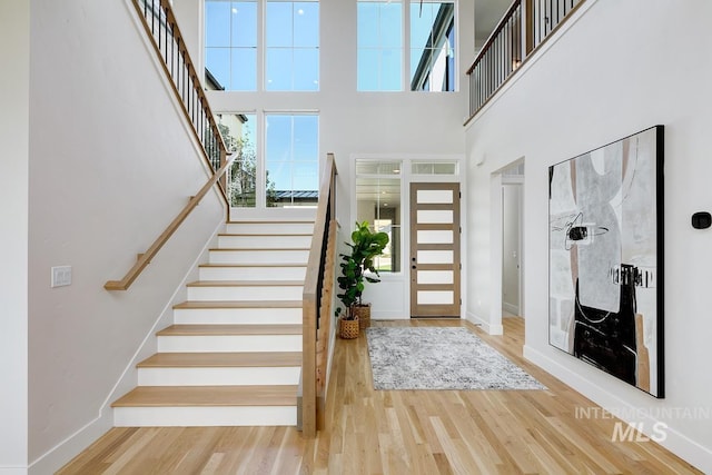 5935 E Marmount Ct, Boise, ID 83716 - entrance foyer featuring stairway, wood finished floors, and a towering ceiling