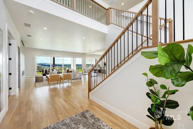 5935 E Marmount Ct, Boise, ID 83716 - stairway with wood finished floors, recessed lighting, and a chandelier