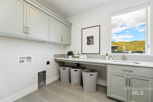 5935 E Marmount Ct, Boise, ID 83716 - laundry area with cabinet space, hookup for a washing machine, and light tile patterned floors