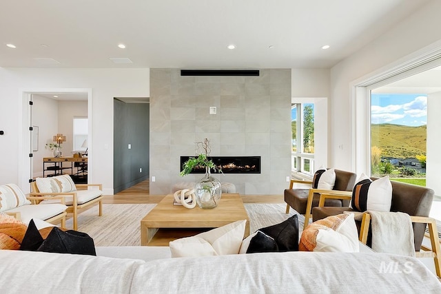 5935 E Marmount Ct, Boise, ID 83716 - living area featuring recessed lighting, a fireplace, and wood finished floors
