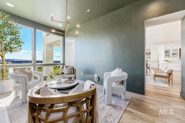 5935 E Marmount Ct, Boise, ID 83716 - dining space featuring light wood-style floors, recessed lighting, and a chandelier