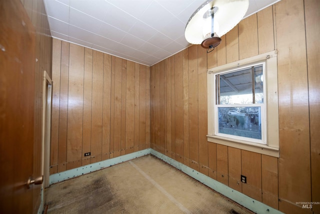 empty room with wooden walls