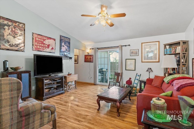 living room with ceiling fan, light wood-type flooring, and lofted ceiling