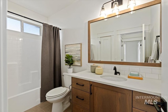 2316 E Valensole St, Meridian, ID 83642 - full bathroom with vanity, toilet, shower / tub combo with curtain, and tile patterned flooring