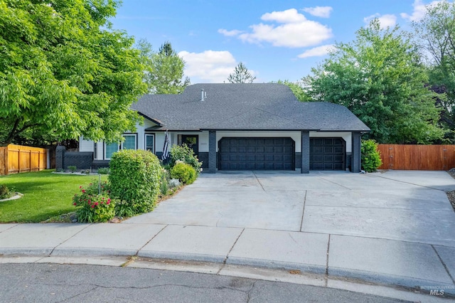 3832 W Aspen Creek Ct, Meridian, ID 83642 - view of front facade featuring an attached garage, driveway, and a shingled roof