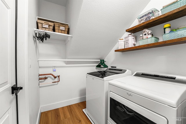 3832 W Aspen Creek Ct, Meridian, ID 83642 - laundry room featuring independent washer and dryer, light wood-style floors, and baseboards