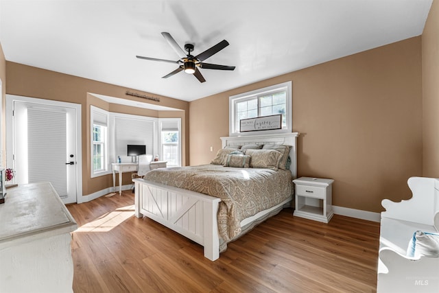 3832 W Aspen Creek Ct, Meridian, ID 83642 - bedroom with light wood-type flooring, an office area, baseboards, and a ceiling fan