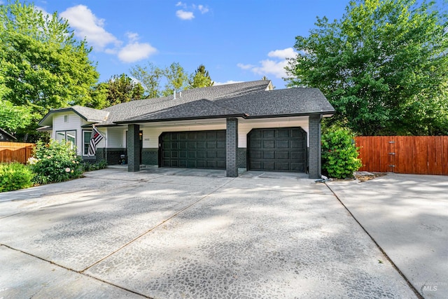 3832 W Aspen Creek Ct, Meridian, ID 83642 - view of front of home with fence, a garage, driveway, brick siding, and a shingled roof