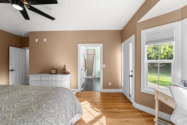 3832 W Aspen Creek Ct, Meridian, ID 83642 - bedroom featuring baseboards, light wood finished floors, connected bathroom, and a ceiling fan