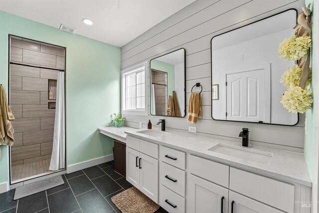 3832 W Aspen Creek Ct, Meridian, ID 83642 - full bath featuring a tile shower, double vanity, tile patterned flooring, baseboards, and recessed lighting