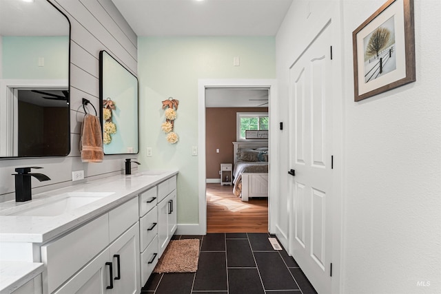 3832 W Aspen Creek Ct, Meridian, ID 83642 - ensuite bathroom featuring tile patterned floors, double vanity, and baseboards
