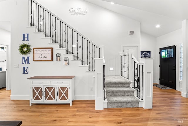 3832 W Aspen Creek Ct, Meridian, ID 83642 - stairs with high vaulted ceiling, baseboards, wood finished floors, and recessed lighting