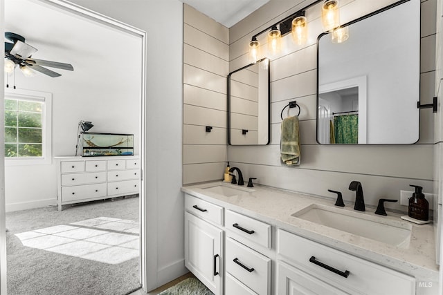 3832 W Aspen Creek Ct, Meridian, ID 83642 - full bathroom with double vanity, a ceiling fan, and baseboards