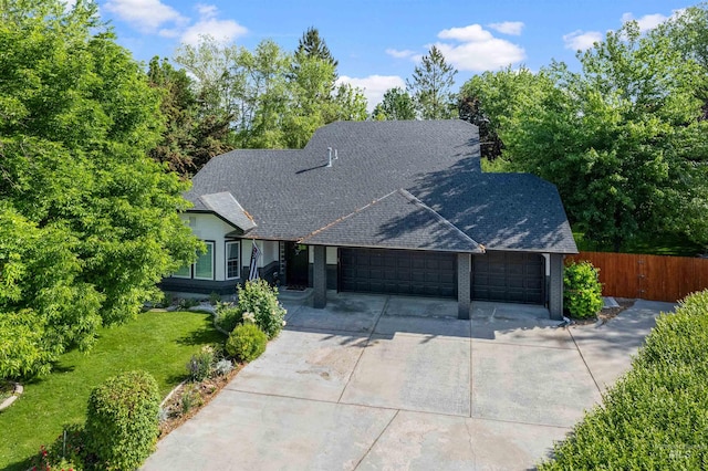 3832 W Aspen Creek Ct, Meridian, ID 83642 - view of front of home with an attached garage, driveway, and roof with shingles