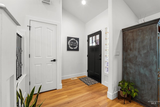 3832 W Aspen Creek Ct, Meridian, ID 83642 - foyer entrance featuring light wood finished floors, baseboards, and high vaulted ceiling