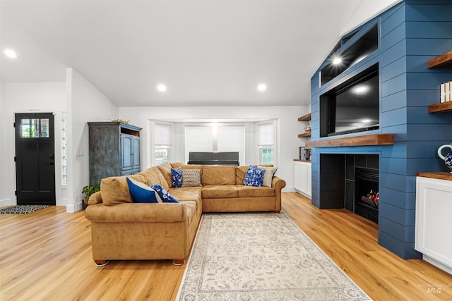 3832 W Aspen Creek Ct, Meridian, ID 83642 - living room featuring light wood-style floors, plenty of natural light, a fireplace, and recessed lighting