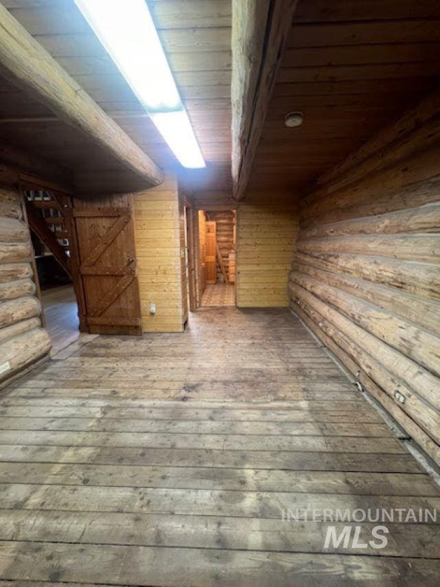 interior space with wood ceiling and hardwood / wood-style floors