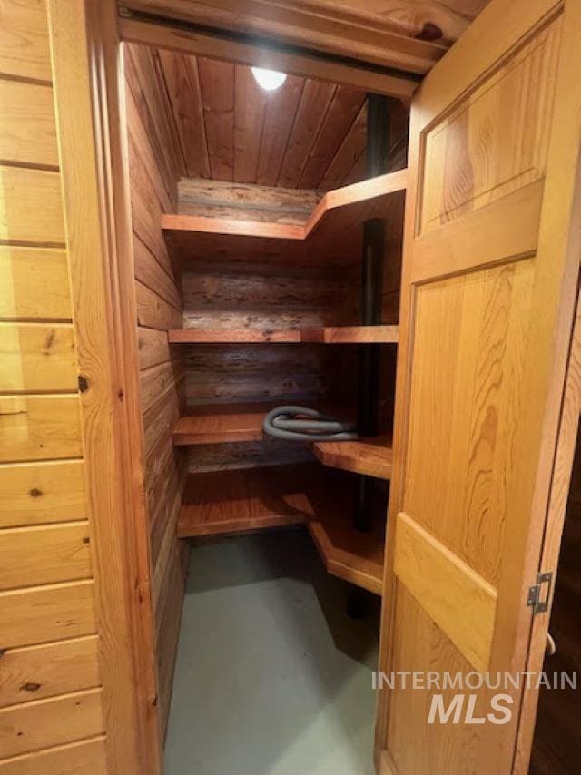 view of sauna featuring concrete flooring