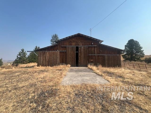 view of outbuilding with a rural view