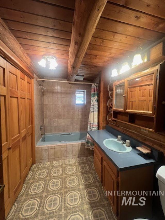 full bathroom with shower / tub combo with curtain, wood ceiling, tile patterned flooring, vanity, and toilet