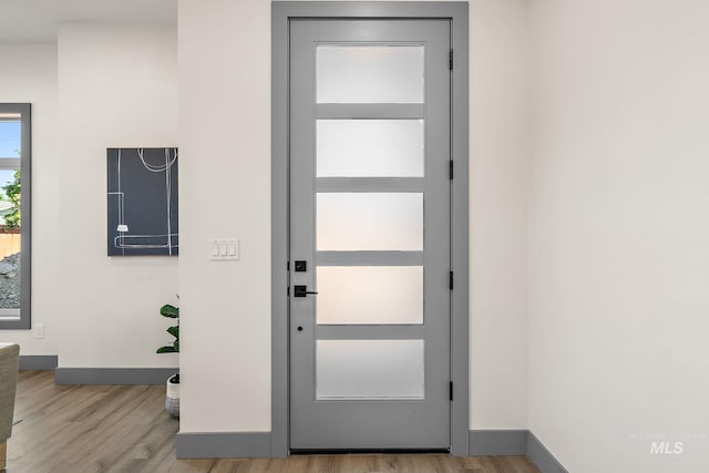 6825 W Ustick, Boise, ID 83704 - entryway with baseboards and wood finished floors
