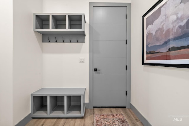 6825 W Ustick, Boise, ID 83704 - mudroom featuring baseboards and wood finished floors