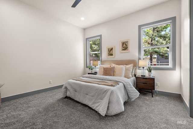 6825 W Ustick, Boise, ID 83704 - carpeted bedroom featuring baseboards, ceiling fan, and multiple windows