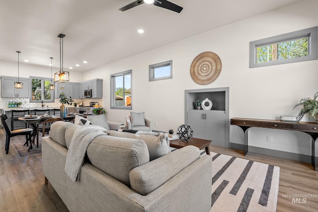 6825 W Ustick, Boise, ID 83704 - living room featuring recessed lighting, ceiling fan, a wealth of natural light, and light wood-style floors