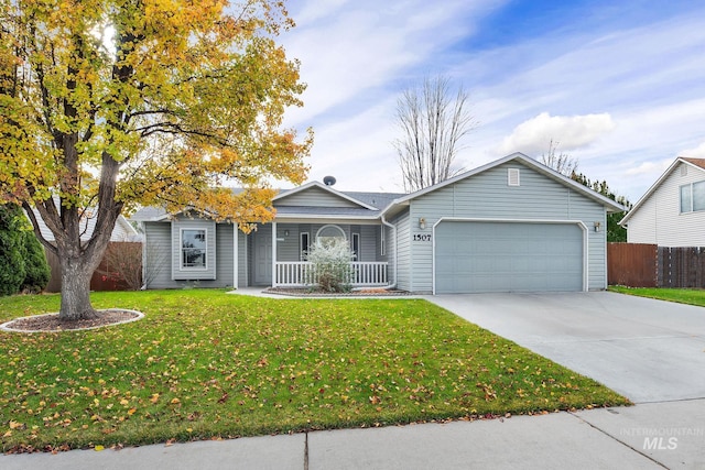 single story home featuring a porch, a garage, and a front lawn